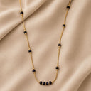 Four black beads set