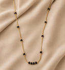 Four black beads set