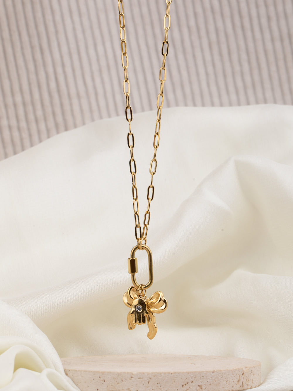 Bow hand charm necklace